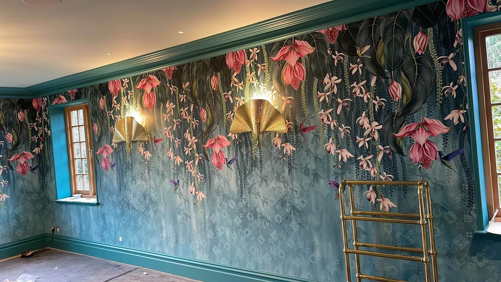 Hand-hung floral mural wallpaper with teal painted woodwork, installed by Bourne Decorators in Binstead, Hampshire